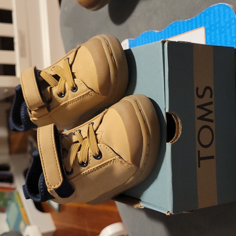 Toddler boy with original box